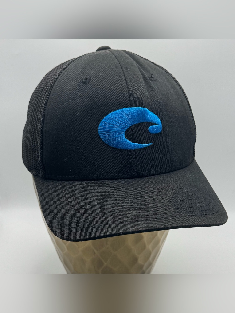 Costa Del Mar Black Mesh Flexfit Hat Blue Logo OSFM Trucker Cap